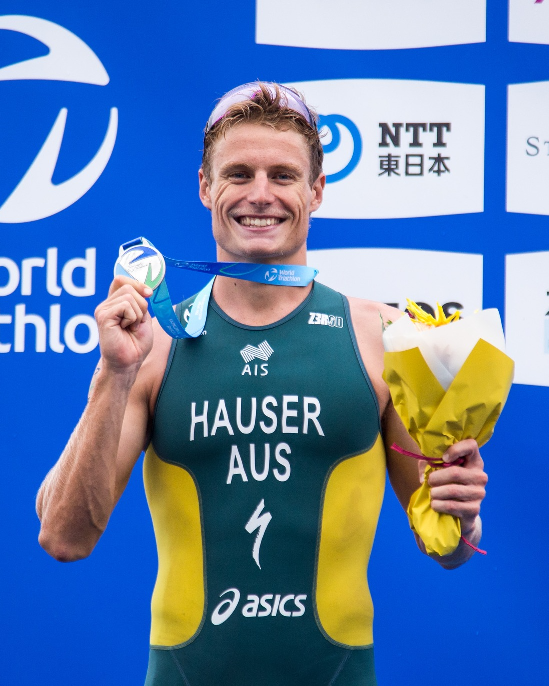 Local Champion Triathlete on the podium overseas